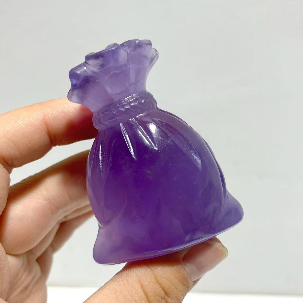 Purple Fluorite Money Bag Carving Wholesale